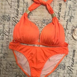 2 piece bathing suit with gold embellishments on the top.  Top size is DD
